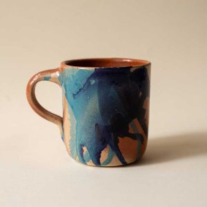 Large glazed clay harlequin mug