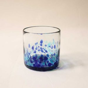 Old Fashioned glass with blurred speckles
